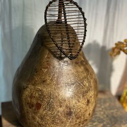decorative large rustic colored heavy pear sculpture with wire stem  Browns and gold with dark brown metal stem 