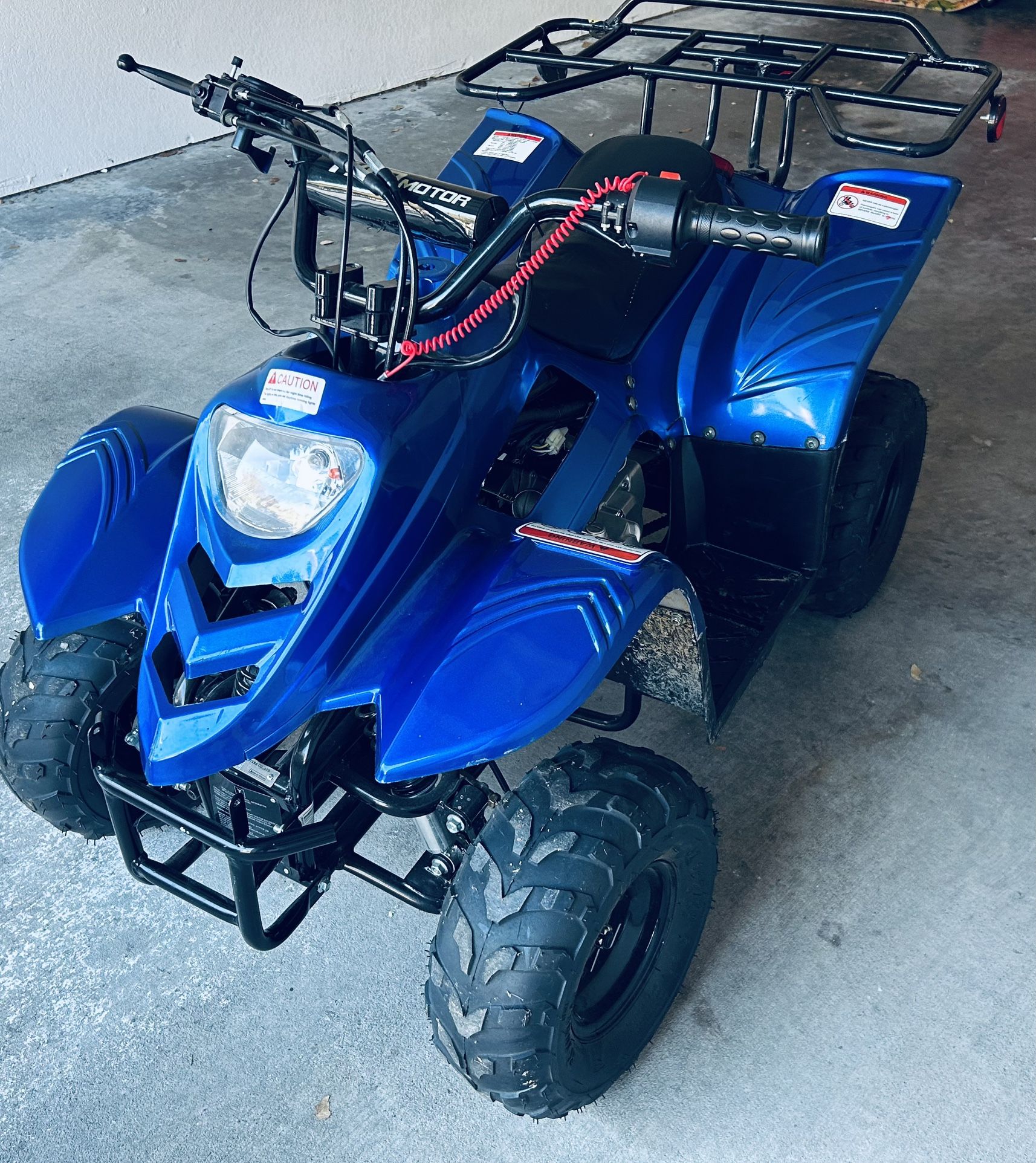 125cc.   4-wheeler And Helmet