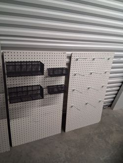 4 4 by 2 foot Peg Boards with 4 Baskets and An Assortment of Hooks 2, 4, and 8 inch