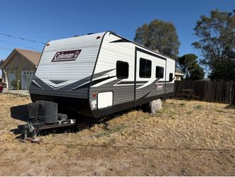 26 ‘ Coleman camper with slid out