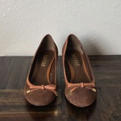 Ralph Lauren Bernee Suede Heeled Slip on Wedge Pump Brown Women's sz 9These pumps feature an almond toe shape and a slip-on closure for ease of wear. 