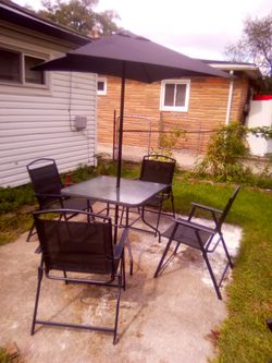 Out side table with 4 chair and umbrella