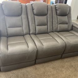 2- Leather Motion Reclining Sofa $699.00 ea