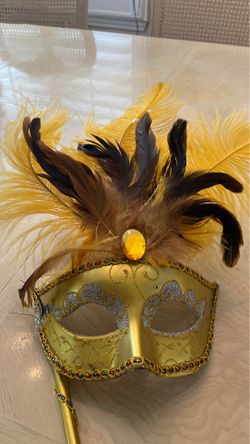 Gold hand held masquerade mask