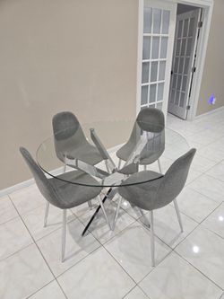Round Glass Dining Table with 4 Grey Chairs