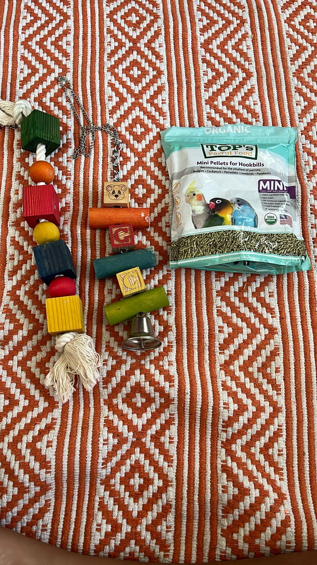 A Couple Of Bird Toys And A Bag Of Pellets (Bird Not Included He Was Just Looking Cute)