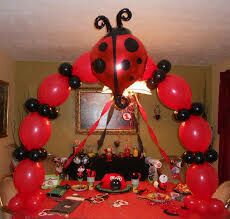 Gymnast balloons ladybug arch