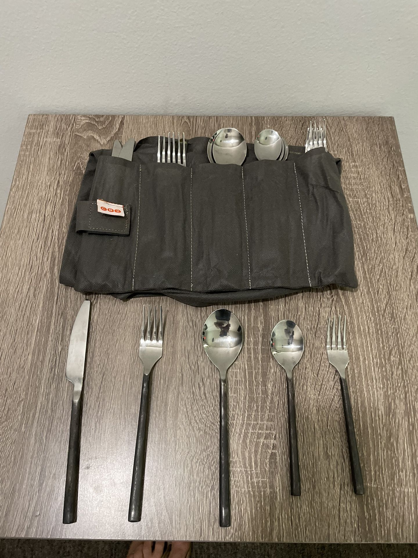 CB2 Abe 20-Piece Brushed Black Flatware set. with travel bag. ex cond. as is p/u deliver.