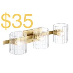 Designers Fountain Aries 24.25 in. 3-Light Brushed Gold Glam Vanity with Ribbed Glass Shades