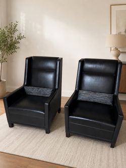 Black leather chairs (2) with pillows