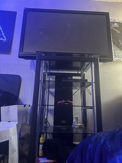Flat Screen TV with Glass Shelf Stand