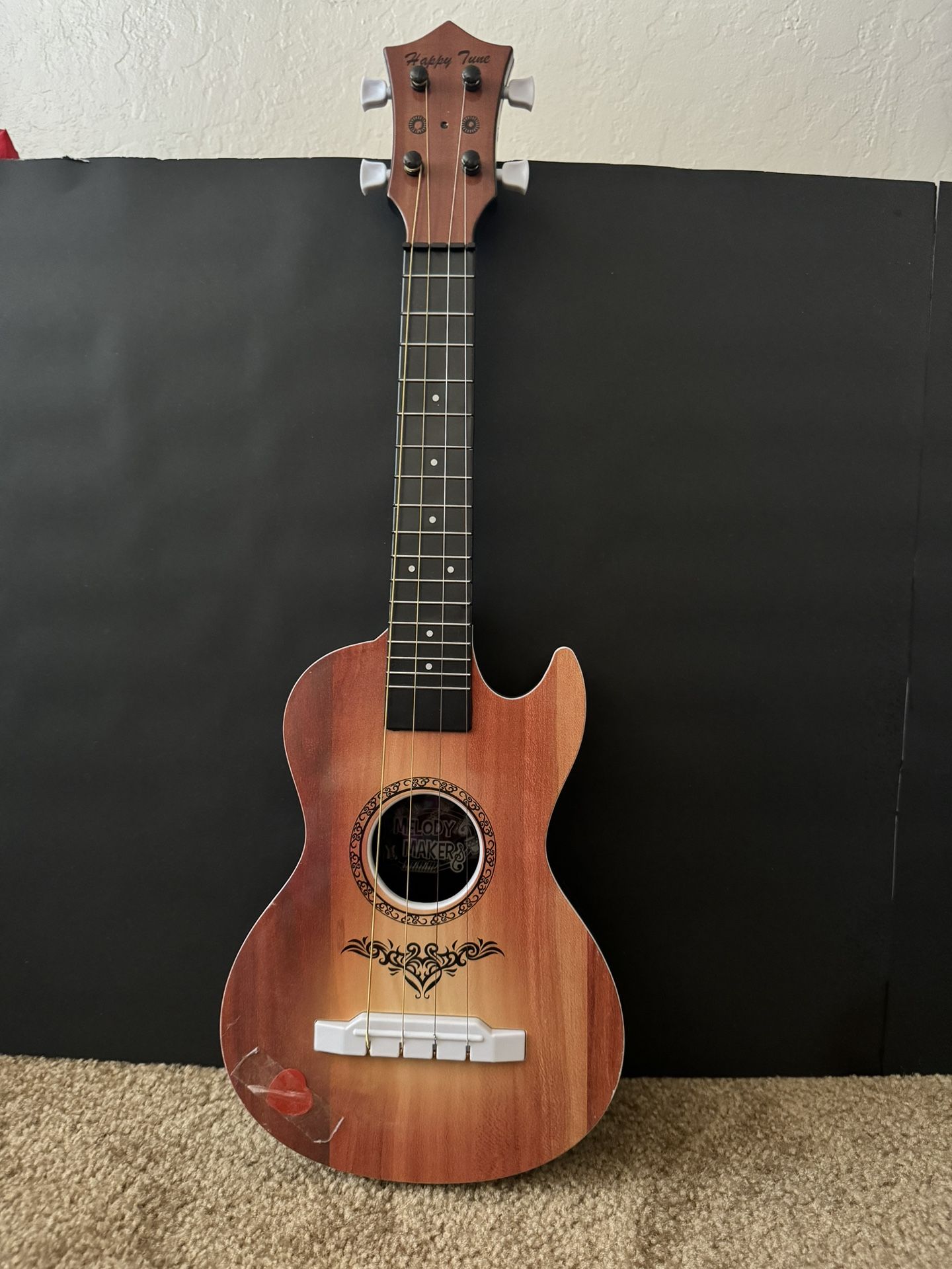 Toy guitar and cat piano