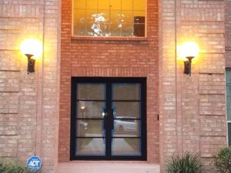 Metal Doors and Clear Tempered Sunlit Glass