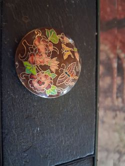 round, brown-toned cloisonné enamel piece