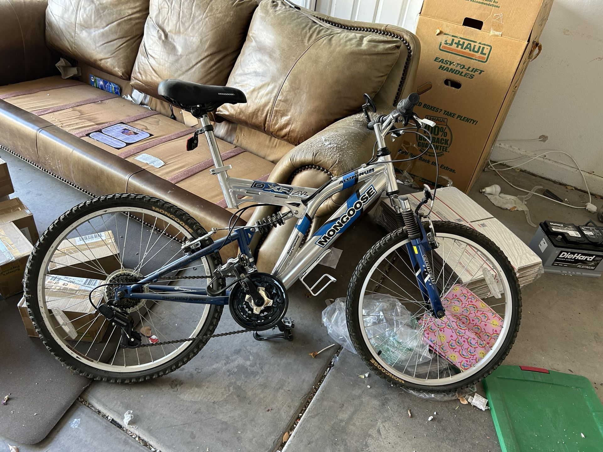 24 inch frame mongoose aluminum mountain bike 21 speed with dual shocks. Needs tires and cleaning