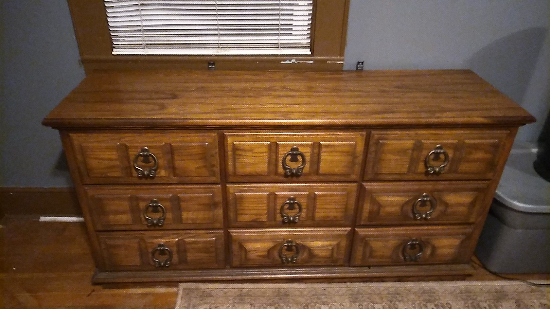 9 drawer dresser with vanity mirror. Mirror attaches to brackets on back