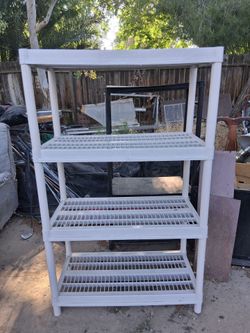 3 Shelf Stand White 58 Inches Tall and 35 Inches Wide  Plastic Shelf Stand