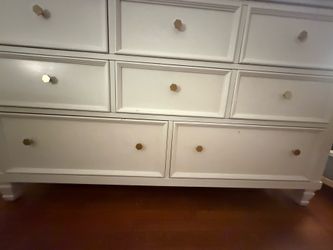 white 8-drawer double dresser with gold hexagonal knobs and classic details