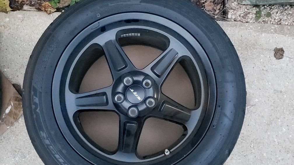Four factory DEMON rims and tires