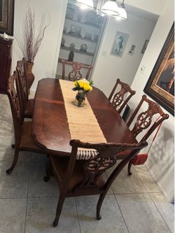 Solid wood table with chairs.