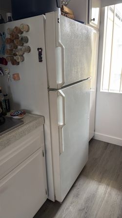 White refrigerator with top freezer