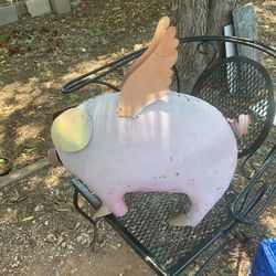 A metal Flying pig it’s 20 inches tall and 21 inches long 