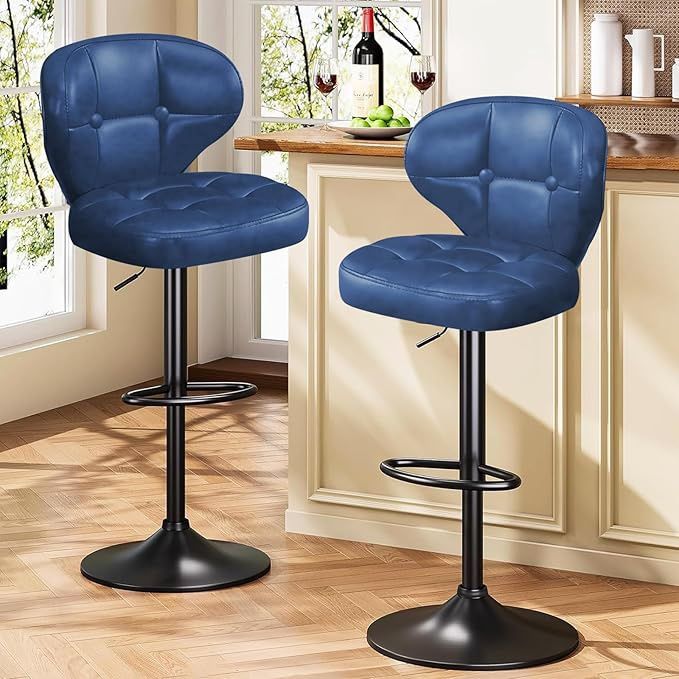 A pair of blue adjustable height bar stools