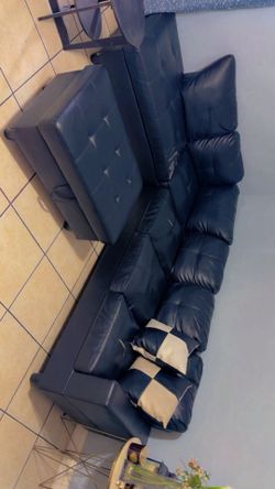 Dining table set with 6 chairs and black leather couch