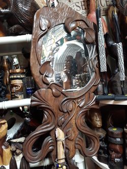 Really unique intricate carved wood frame mirror