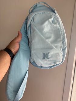 light blue Hurley Horizon Crossbody Sling Bag featuring a thick