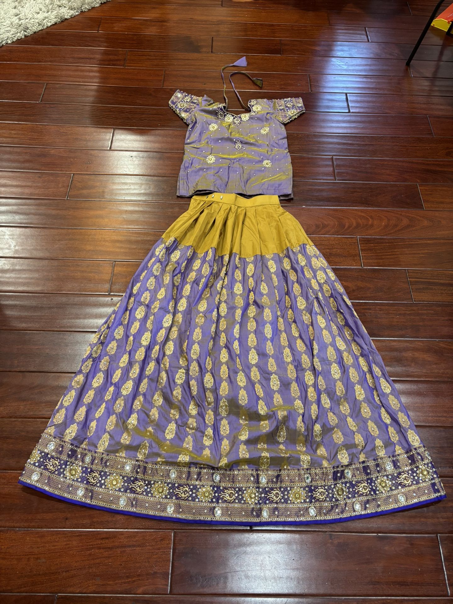 Pure Silk Lehenga with Heavy Embroidery and Stone work.