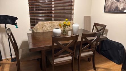 Large wood dining table with chairs and bench