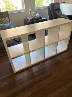 IKEA Kallax 8-Cube Shelf Unit White and 4 wicker bins