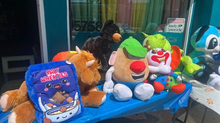 Stuffed animals , pillows , cartoon and Disney characters