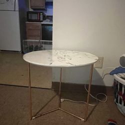 Rounded white marble table