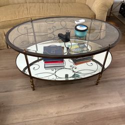 Coffee Table Oval, Glass With Antique Gold Metal Finish.  48"L x 33"W x 21"T