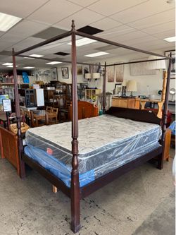 Dark Wood Four-Poster Canopy Queen Bed