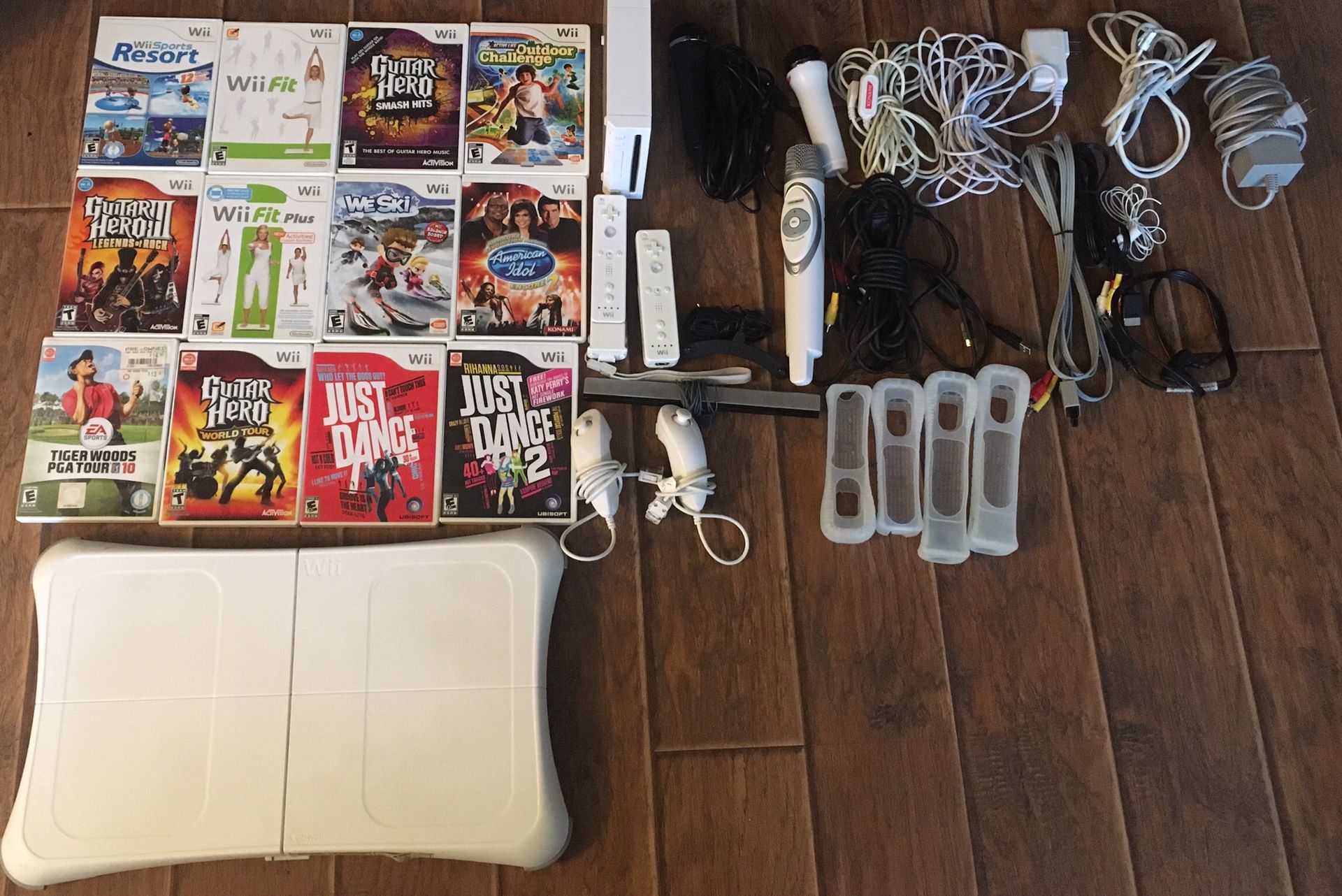 Nintendo Wii, 9 Video Games, Wii Fit Board, and USB Wired Karaoke Gaming Microphone