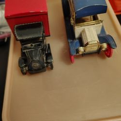 Two Metal Delivery Trucks