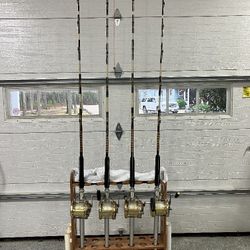 4- heavy off shore custom Tuna fishing rods with 80 Penn internationals.
