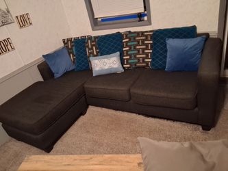 Blue L Sofa with designer pillows