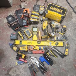 Assortment of DeWALT and KLEIN tools