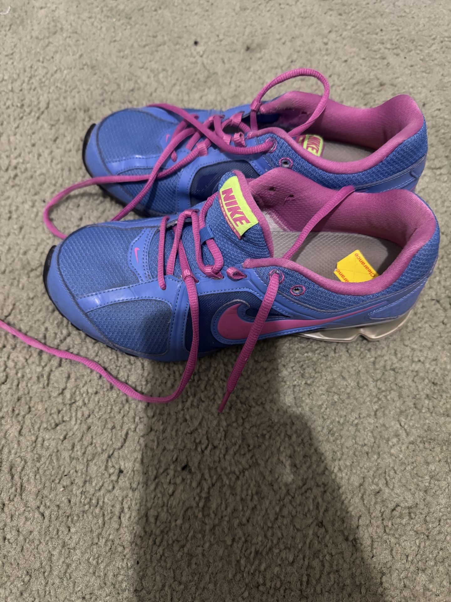 Blue and Pink Nike shoes