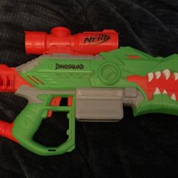 Nerf DinoSquad Rex-Rampage Motorised Dart Blaster, 10-Dart Clip, 20 Nerf Darts, 10-Dart Storage - T-Rex Dinosaur Design, Multicolor