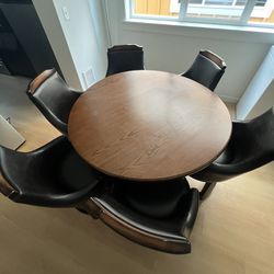 wooden Dining table with 6 swivel chairs