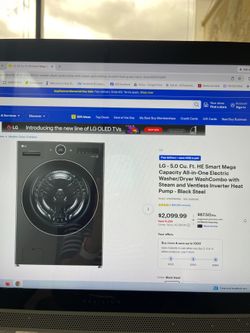 HE Smart Mega Capacity All-in-One Electric Washer/Dryer WashCombo in the sleek Black Steel finish, complete with a matching LG storage
