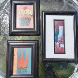 three framed prints features culinary-themed artwork by artist Sarah Van Beckum. 