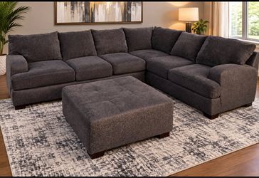 Beautiful large dark gray sectional sofa with an ottoman can be delivered in the ares of Tampa and its surroundings Presio 300