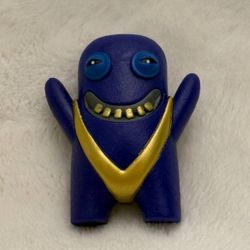 Fuggler 2.5" Blue Sumo monster mini figure wearing a metallic gold sumo belt
