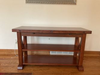 Console sofa table that opens to dining table